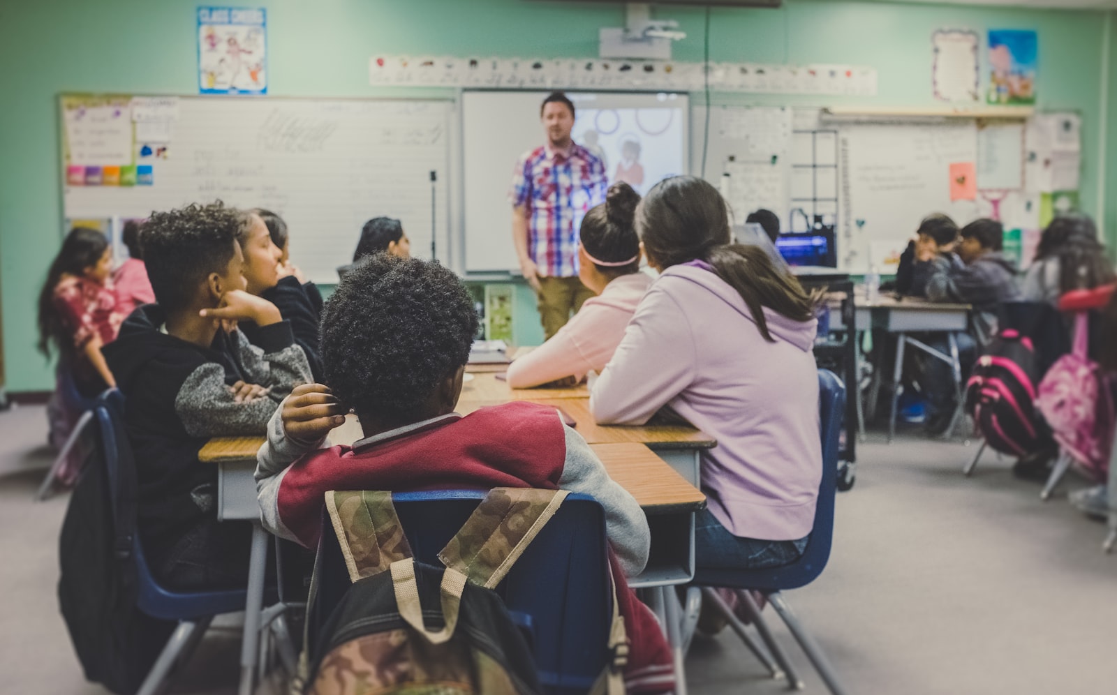 A group of young people in a class with their leader